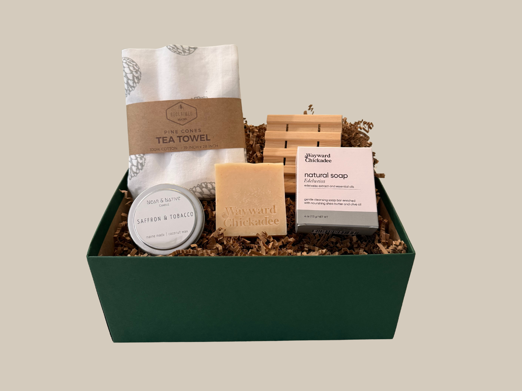 Gift basket with tea towel, soap, and other items